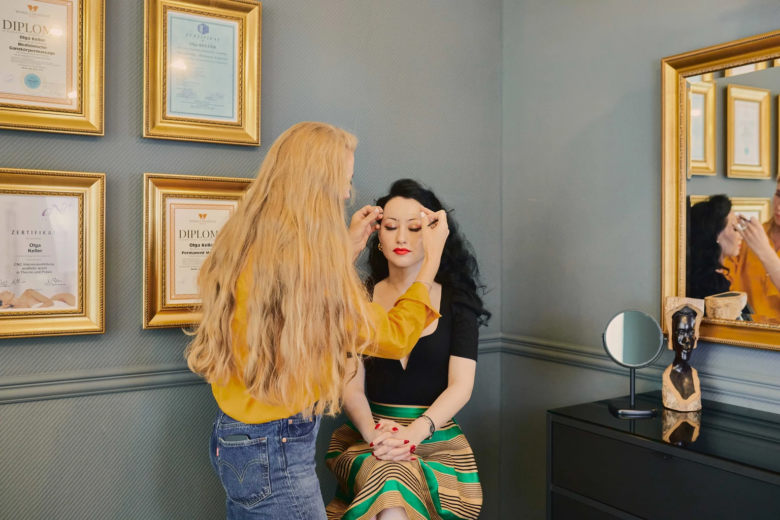 Olga Keller treating a client in the studio